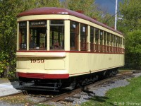Montreal Transportation Commission tram 1959 is pictured at Exporail in October 2012, giving rides to visitors around the museum grounds. It was originally built by Canadian Car & Foundry in 1928, and operated in Montreal until the streetcar or "tramway" system was replaced by buses in the 1950's (August 30th 1959 was the final historic day). MTC 1959 was acquired by the Canadian Railway Museum in 1963, along with a number of other vintage Montreal cars.
