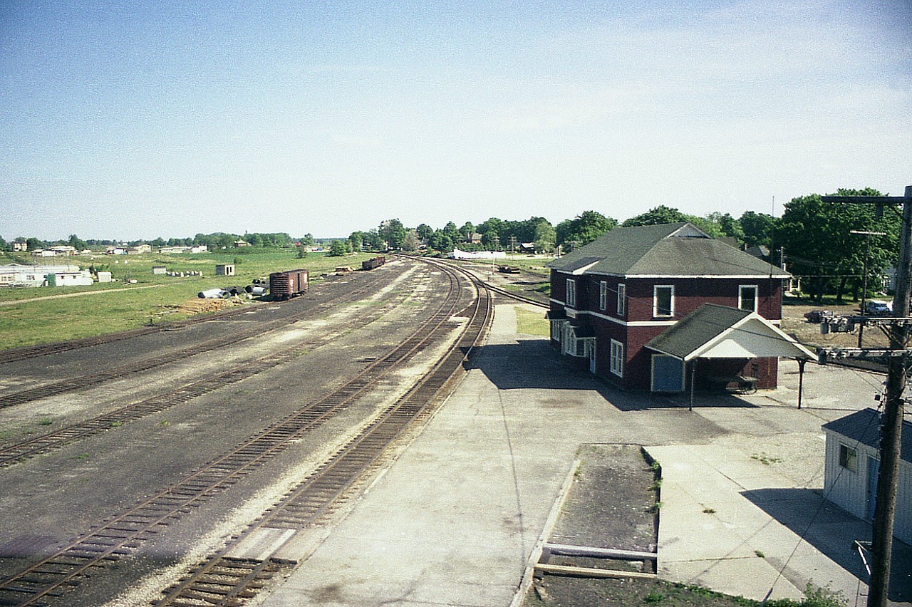 What a sad state of affairs. Very few other towns, in the sense of the railroad, went from so much to so little. In the steam era, Palmerston was a busy hub, with branch lines spreading out in all directions. Palmerston was a division hub. There were shops, roundhouse, car repair shops and a large yard and turntable. By 1977 the Owen Sound sub branched off to only the Newton sub to Stratford and the Fergus sub to Lynden, where it joined the CN Dundas Sub. By the mid-90s there was nothing. Forward thinkers saved the old station. It is now the home of the Pslmerston Heritage Railroad Museum. The old steel walkway over the yard, which spanned the original 8 tracks, still stands and is considered a town landmark. The yard is gone, and in this photo one can see evidence of it being dismantled, but newly laid track is now in place below the walkbridge. There is 300 yards of it. Handcar Races are held here each year, and the winning team is crowned Canadian Handcar Champions. Modern handcars, built for these races are used, and the event is witnessed by large crowds of cheering spectators. Palmerston owes its existence to the railroads,and although they are now long gone, they are not forgotten. 'Railroad Days' see to that.