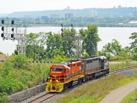 Southern Ontario Railway light power is en route from Hamilton to Brantford, seen here just after entering the Cowpath at Hamilton Junction.  Part of the western Hamilton waterfront area and buildings can be seen across Burlington Bay, and railcars in the CN/SOR Hamilton waterfront yard. <br><br>
RLHH 2081 has been upgraded to GP38-2 standards.  Originally built by EMD in Nov 1966 as Maine Central GP38 MEC 258, in between it had been NHVT 3800, HLCX 3619, TOR 2000, and RLK 3873. 