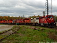 <br><br>Phil Hall recently commented: "these days power is assigned by HPT. In the good old days it was all about the ruling grade" - I think this is an example of a ruling grade train no? Instead of taking the Oakville sub this train had enough power to tackle Waterdown Hill so up it went..<br><br>The fact this came as a suprise really goes to show how much has changed in our fanning world in 12 years. It's hard to believe, but we didn't always know what was running and back on this day, I was at Hamilton West with some friends and this Northbound went by after Barnes Turn returned form working the Compass Minerals plant. We knew a SD40-2 was leading, that was just normal - the scanner being our source of information. Once we saw six locomotives.. I had to chase it. I didn't know the roads well so I didn't chase for multiple shots, instead I just went straight to the jct and got this photo, and I'm glad I did.<br><br>The funny thing I was thinking about this - Since 2001 I have carried a Blackberry and by 2005 I was well connected to various chat groups (one of which I started with a friend - you are welcome to join us if you want - <a href=http://hostovsky.com/cgi-bin/irc.cgi target=_blank>#railfan on IRC Chat - since 2003!</a> ) but for the most part, before Facebook, before Twitter, not too many people carried the Internet while 'fanning and I was mostly communicating with people on desktop computers at home. Phone calls still dominated any sighting reports and naturally to very small groups. It didn't take long for people to get Blackberries in the next year or two, and the <a href=http://groups.io/g/fpon target=_blank>FPON (Join us if you want sightings for Ontario!) </a> group was started to take advantage of technology and it's only taken off since then to other arenas such as Facebook and what not. I'm amazed how simple it was 12 years ago compared to today.<br><br>If anyone has noted to what train symbol this was it's appreciated. Thank you. 