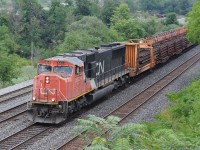 Continuous welded rail train powered by SD70i CN 5624 heads west on the Oakville Sub toward CN Snake. <br> The bulkhead rail carrier car behind the engine is CN 46561.