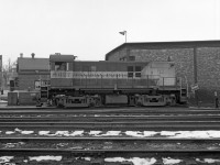 MLW RS-23 CP 8027 is seen here beside the Trois-Rivieres roundhouse in (approx) March 1971.<br> In 1970-71 its siblings CP 8035 and 8040 were much more frequently seen here. The RS-23's did their yard switching singly, I never saw them MU'd in pairs. Alco S-2 switcher CP 7042 was another regular.  <br><br>
No structure or tree visible beyond the tracks remains - the CP structures were all demolished, while the adjacent neighborhood was cleared to make way for Quebec Autoroute 40. Quebec Gatineau Railway serves T-R now.