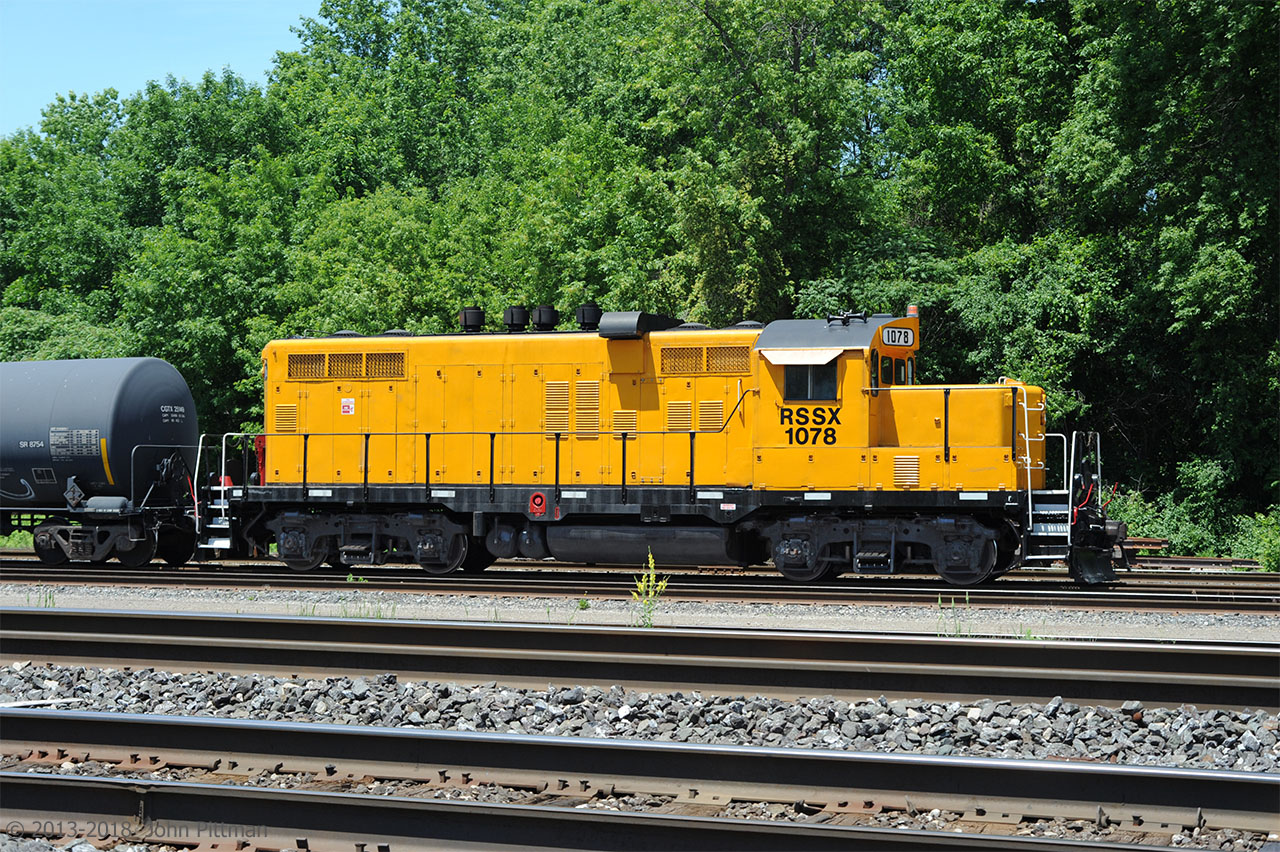 This orange GP10 on the roster of Rail Switching Service was dropped off at Aldershot Yard by an eastbound CN train, could have been 422. Apparently it was in transit - I never saw it again. 
It wore overall black paint previously as ICG 8100 and then MSRC 1078 (Midsouth Rail Corporation).  
The four exhaust stacks and air intake box are typical for GP7/GP9/GP18 rebuilt into "GP10" at IC's Paducah KY shops.