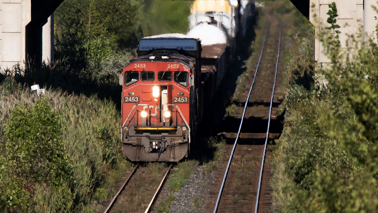 Wandering out of Mac Yard, with the A/C on full, 2453, BCOL 4610, and an SD75 rumble a huge train under Hwy 400 westbound towards the Humber River Bridge
