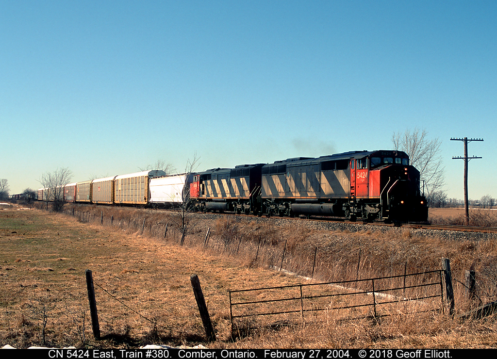 A pair of SD50F's lead CN Train #380 past the "East Siding Switch Comber" on the CASO Subdivision back on February 27, 2004.  Sadly the tracks are now all gone, as well as the units.  I guess nothing lasts forever.....