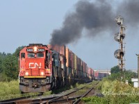 Train 148 led by CN 5459 departs Sarnia with a smokey 3rd trailing unit(BCOL 4625).