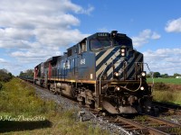 Due to issues with CN 5485 which was the leader coming into Sarnia it was decided to wye the power and make 4648 the leader which was fine with me. Here they are east bound on a slow roll out of Sarnia at Telfer Sideroad.