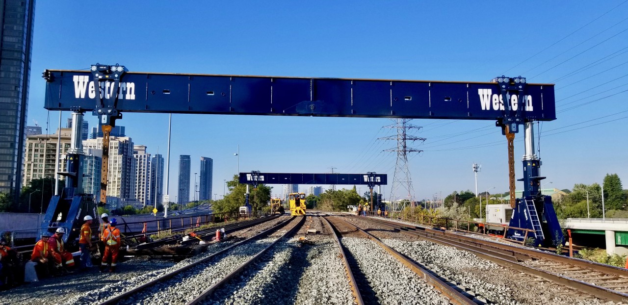 THE BIG LIFT. Well all of the planning and preparation is finally coming together. 
Metrolinx replacement of the Humber River Bridge started a long time ago. They waited until the CNE was over and for the past 2 weekends they have been getting things in position for the big lift. This coming weekend and for the next 7 weekends starting on Friday nights until Monday mornings.
The specialized gantries are in position to remove the old spans that will be placed on waiting flat cars and the new spans (also on flatcars at VIA TMC) will be put across the river.
You can see it all taking place from the pedestrian bridge over the Humber River on The Queensway for the next 7 weekends.