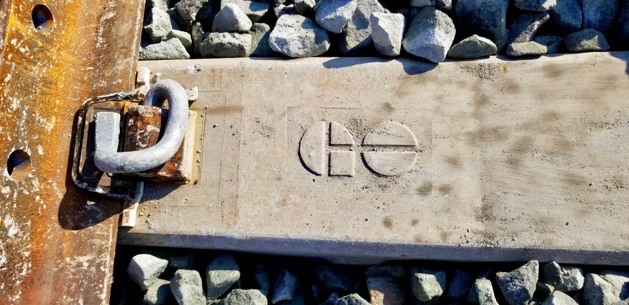 I guess you must be a pretty important customer to have your own personalized railroad tie.
Brand new track, brand new ballast, pandrol clip and brand new concrete rail tie for Metrolinx/GO. 
This track is part of the new approach tracks leading towards the Humber River. Over the next 7
weeks the bridge spans will be replaced with new ones as the over 100 year old bridge is replaced.