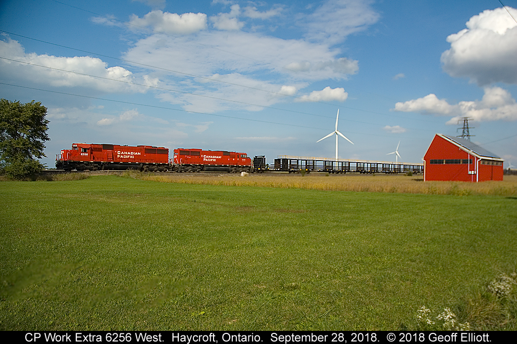 Work Extra CP 6254 West lays rail along the Windsor Subdivision just west of Haycroft, Ontario on September 28, 2018.  Nice to be able to shoot a CP SD60, SD60M, and a "Red Barn" all in the same shot in 2018.... ;-)