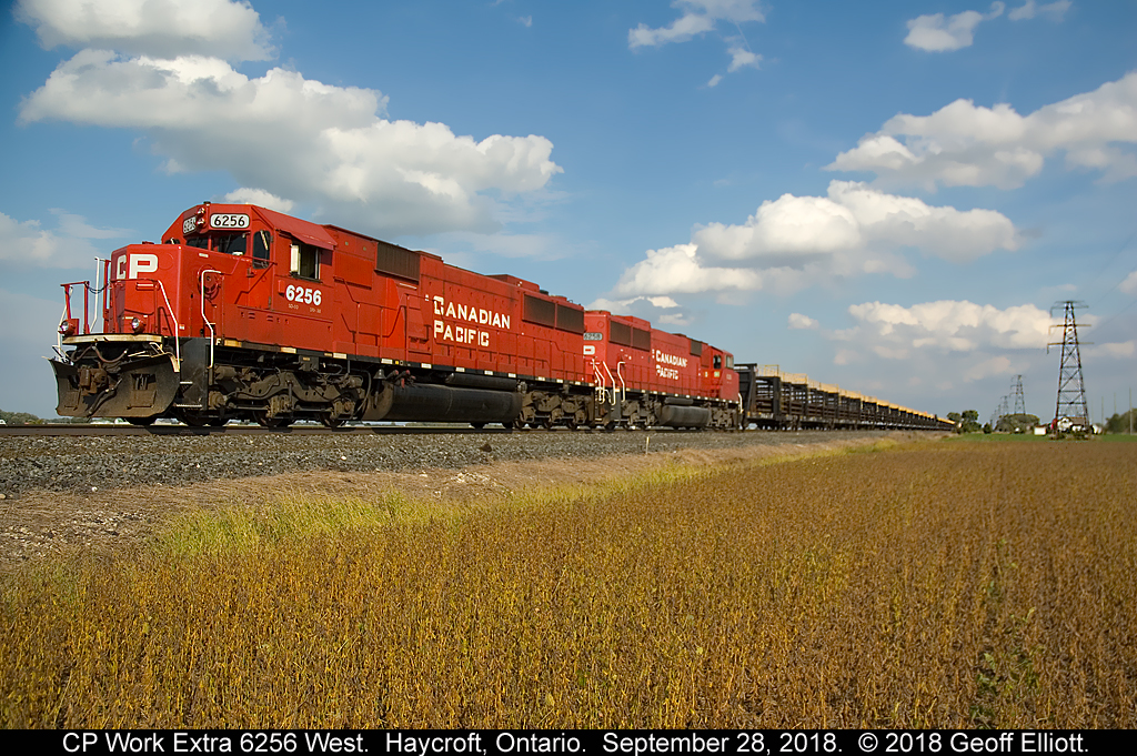 Work Extra CP 6254 West lays rail along the Windsor Subdivision just west of Haycroft, Ontario on September 28, 2018.