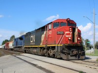 Only a select few “Draper” Dash-8s have received CN’s newest paint scheme and of those I believe this is the only one equipped for DPU service. The humidex is in the mid 30’s and 2421 has the AC on high, LOL. In other words all cab doors open :) I’m sure the crew wishes they could spin the power and have A/C equipped  CITX SD70M-2 #140 in the lead. The mixed westbound is seen re-entering the double track at Stewartown.