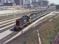 A hot August afternoon and CN 8512 is hostling some RDC units to or from Toronto Union Station.  So much has changed in this area since this image was taken. Personally I like it the way it was.