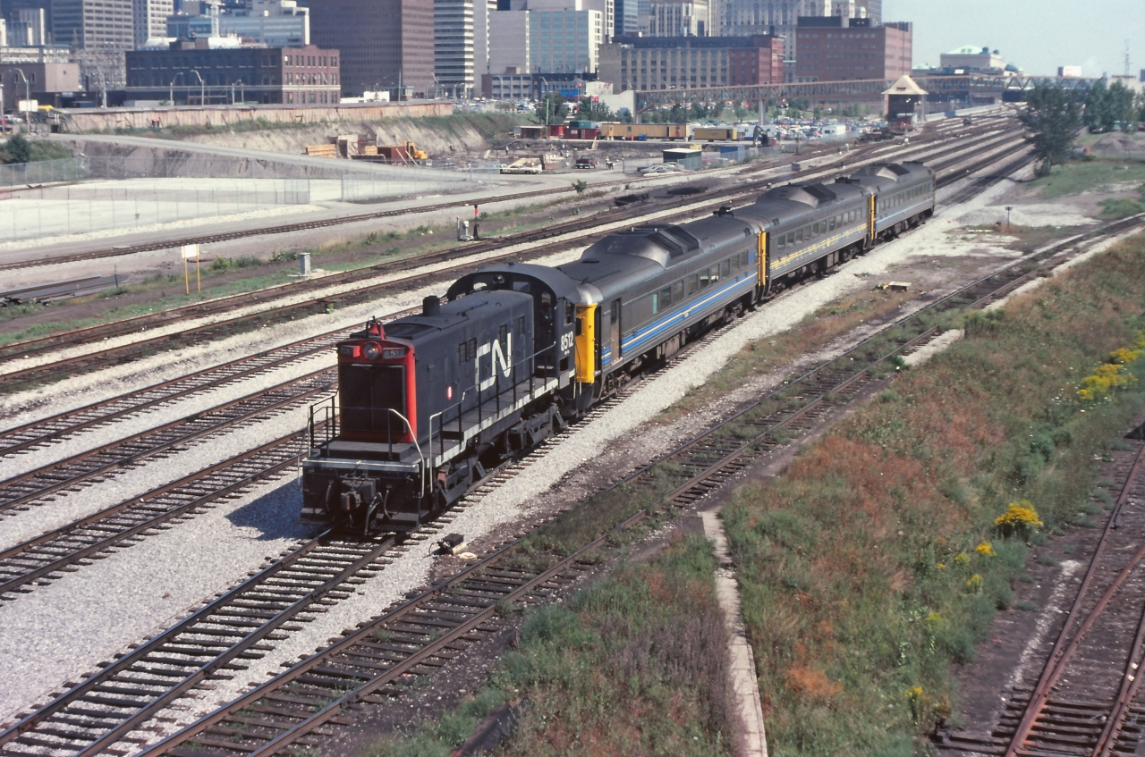 A hot August afternoon and CN 8512 is hostling some RDC units to or from Toronto Union Station.  So much has changed in this area since this image was taken. Personally I like it the way it was.