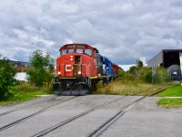 After having finished switching the Unilever Plant near Martin Grove Road and Highway 409, CN 559 crosses Vulcan st on their way back to the main, passing by Brenntag Canada (the factory on the right where the tank car is sitting) which is another one of the very few rail consumers left on the remains of the Highbury Industrial Lead. Train also had a rare 5 engine lashup with the second unit being one of CNs new leased GMTX gp15s. 