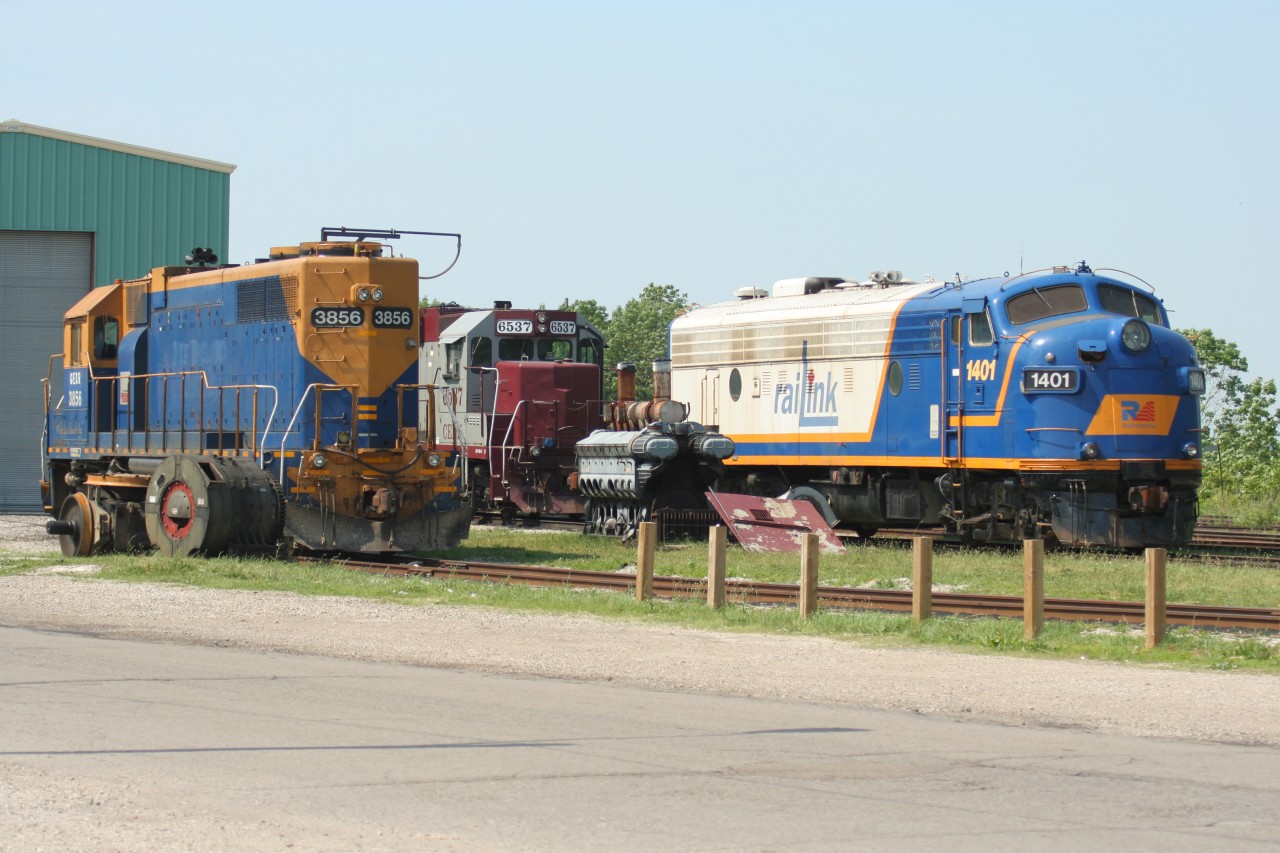 11 years before being repainted into Ontario Southland Railway colors, RaiLink FP9u 1401 sits at the Goderich-Exeter Railway shop in Goderich, Ontario with stored CEFX GP38-3 6537 and GEXR GP38 3856, which was undergoing routine maintenance.