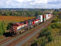 CN 149 rolls through Newtonville with an exceptional trio consisting of BCOL 4644-5750-BCOL 4605.