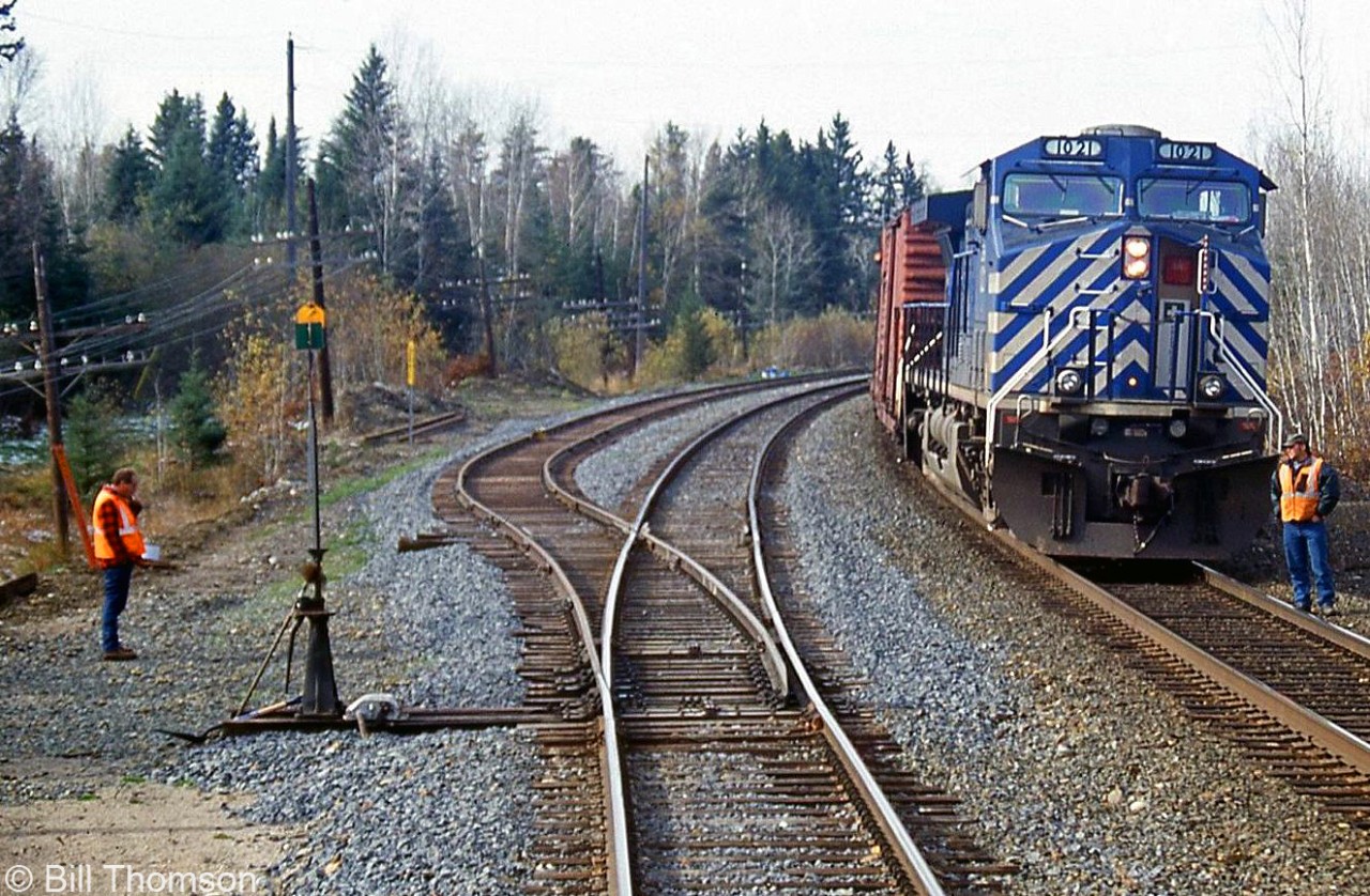 A view from aboard the VIA Sudbury-White River RDC shows a meet with a CP freight lead by CEFX 1021, pictured at "Esher" at MP 8.8 on CP's White River Sub.