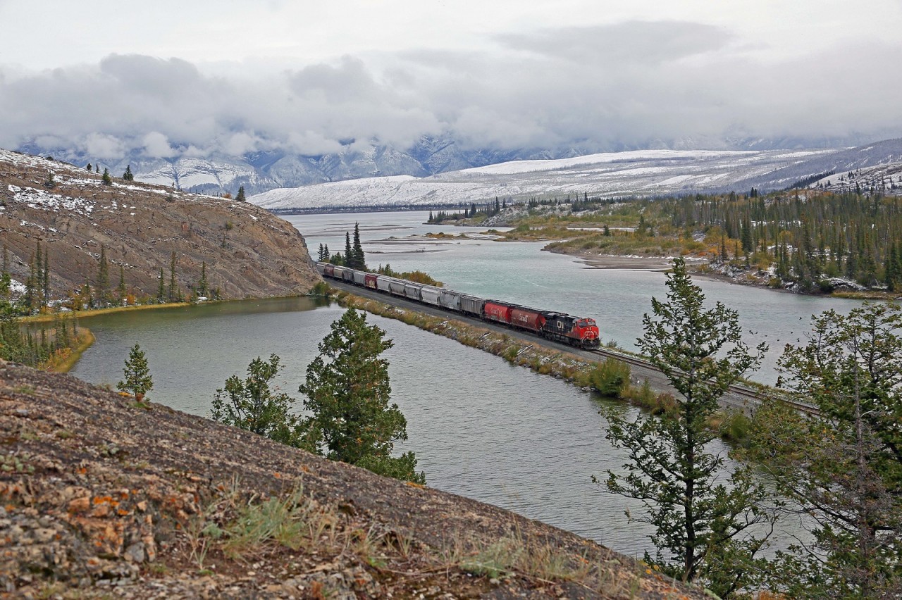 CN 2919-303, with mid-train DPU 2868 passes Windy Point at mile 220 on the CN's Edson Sub in Jasper National Park. Temperature was 1°C and a little snowy.