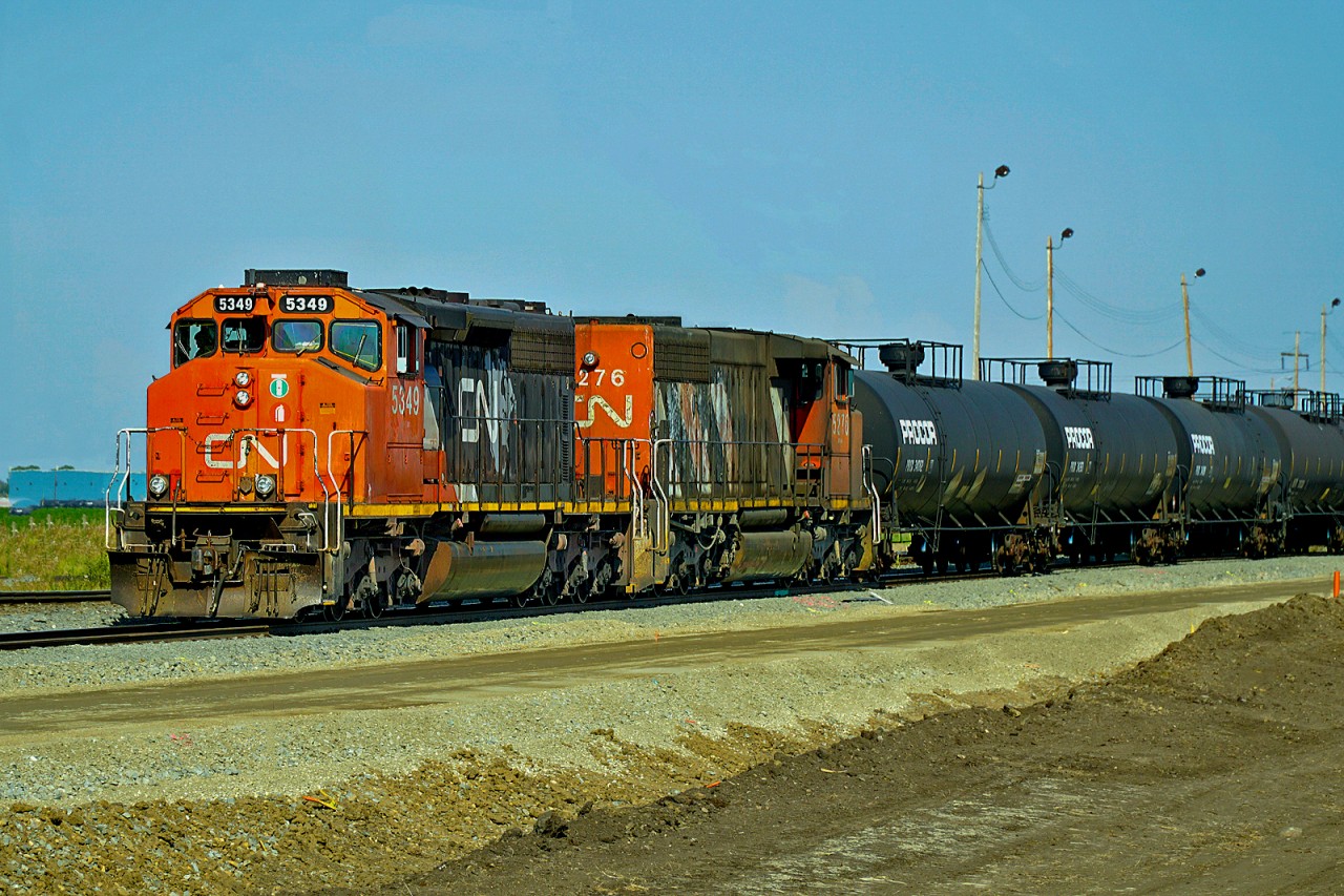 Switching duties on the Fort Saskatchewan Industrial Lead this afternoon were in the hands of a pair of SD40-2(W)s, Cn 5349 and CN 5276.  Seen here arriving at Scotford pushing their cars back into the yard.Yard