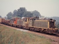 The radiator shutters on top of the hoods are wide open on all three of these CN SW1200RS locos as they head toward Hamilton on the Oakville Sub. Note the two loaded general service gondolas at the head end of the train.  HO kits of these interesting cars were made from die cast components by Ulrich Models.  Unfortunately, Ulrich is no longer in business as of 2016.