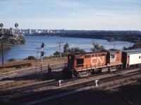 CN train 144 drifts down the grade into Bayview behind Tempo RS18 3152 on a fine September afternoon in 1973. At the time, CN ran four pairs of passenger trains to/from Windsor, one to/from London, three trains to/from Sarnia, and three trains to/from Niagara Falls through Bayview. Still more ran via "the back route" through Guelph and Kitchener.

A great source of old passenger schedules is found here (CN and CP public timetables):
https://www.dropbox.com/sh/1rriwxrhmll3lmr/AAB5P4McatYTnsEYzbLG5kK2a?dl=0 