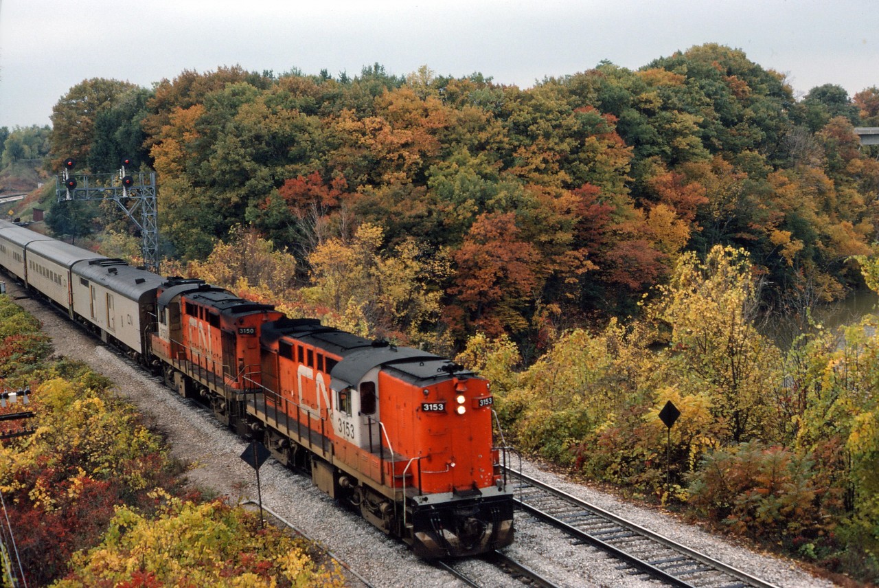 Autumn leaves haven't quite reached peak colours on this October day in 1975 as a pair of RS18s accelerate away from Bayview with Tempo train 140 from Windsor.