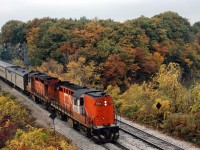 Autumn leaves haven't quite reached peak colours on this October day in 1975 as a pair of RS18s accelerate away from Bayview with Tempo train 140 from Windsor.