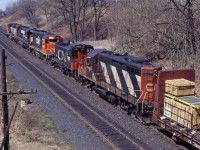 You can almost hear this train straining to crest the Dundas hill at Inksetter's Road near Copetown. This westbound has an interesting variety of power: CN GP40-2LW 9449, NS C30-7 8035 (at the time, on lease to CN), GTW GP40-2 6423, CN SW1200RSu 7311, and GP9u 4123...oh, to have caught this on video!