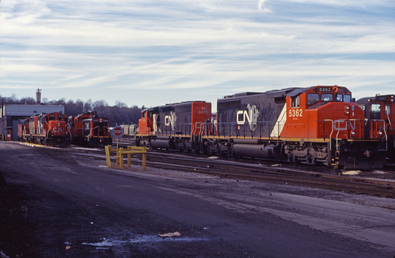 Once again, the trip to the Stuart Street diesel shop has been fruitful. On this morning in December 1994, I caught SD40-2Ws 5362 and 5314 in the short-lived "CN North America" paint scheme (phased out when CN privatized), a pair of SW1200RS' (7307 behind the SDs, and 1388 wearing the "switcher" version of the CN North America scheme), an unidentified "SWeep", GP9RM 4110 and another GP9 rebuild, and a van.