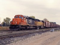 In the early 1990s, CN embarked on a program to rebuild its SD40 fleet and supplemented this with the acquisition of used SD40-2s no longer required by Union Pacific. Here we have one of each, SD40u 6004 (rebuilt from CN 5079 at Pointe St. Charles shop, Montreal in 1993) and 6094 (ex UP 4094, MP 3094 and 794; eventually rebuilt into the CN 5372). The train is about to work the yard at Aldershot East.