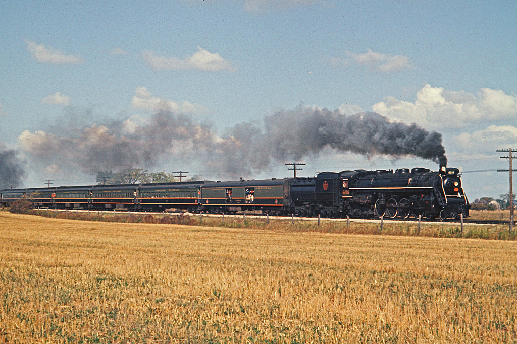 CN 6218 has crossed the CASO Sub at Canfield Jct and is heading toward Dunnville.  Most of the passenger cars were in the green, black and gold paint scheme.