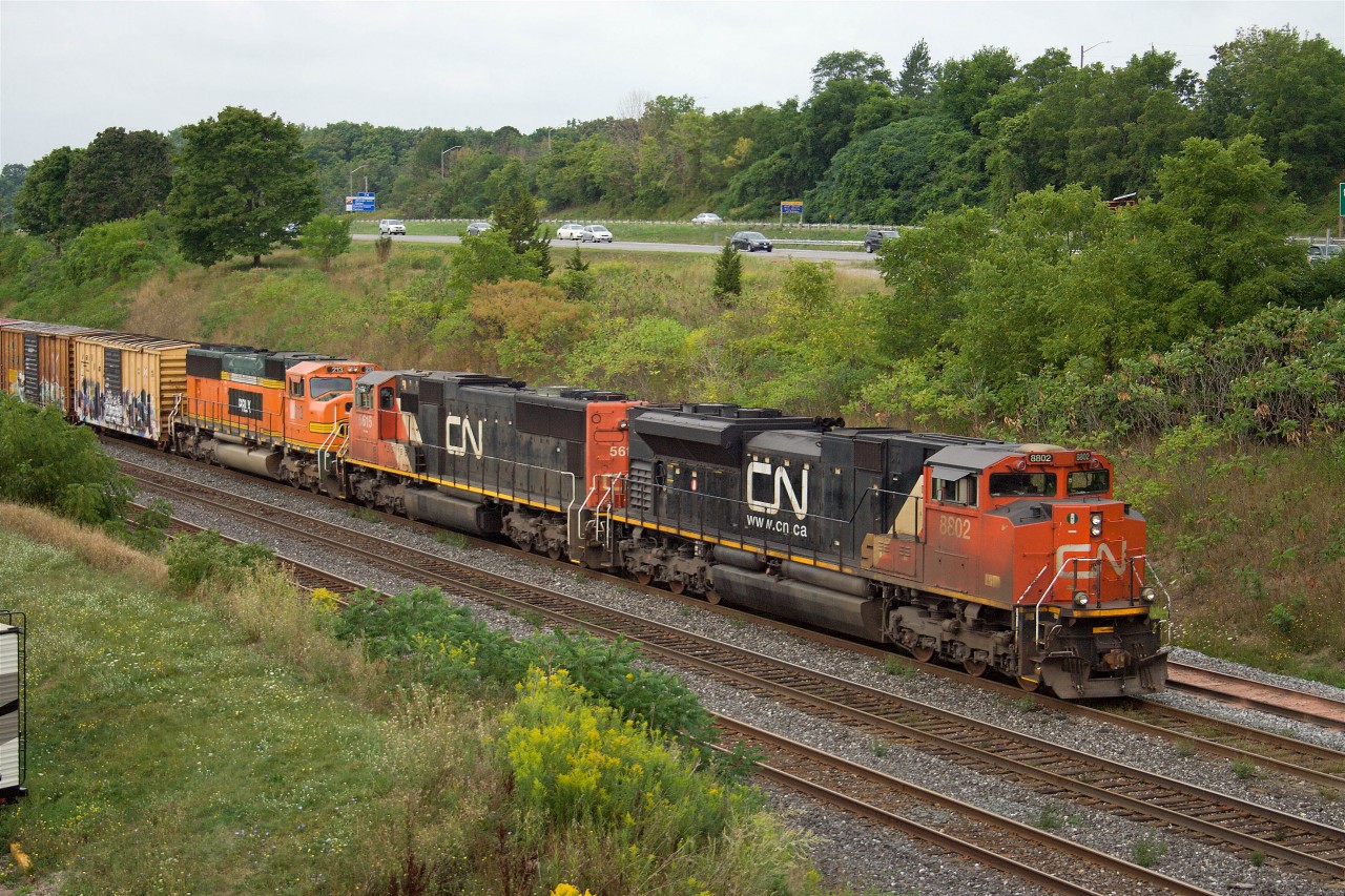 Topping off eight trains in about 90 minutes (1 VIA, 1 VIA/Amtrak, 2 GO, and four freights--385, 148, 273 and 422), the Port Robinson-MacMillan Yard freight prepares to work Aldershot from number one track with CN SD70M-2 8802, SD70 5615, and PRLX SD75 213...then the rain moved in!