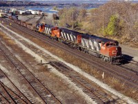 What looks like MacMillan Yard-Niagara Falls train 449 works Hamilton Yard on fine fall day in 1994. Power is GP40-2W 9636, M420W 3578, GP9RM 4141, and SW1200RS 1375. I don' recall whether the last two units were set off in Hamilton or went on to the Falls for use on locals in the Niagara region.