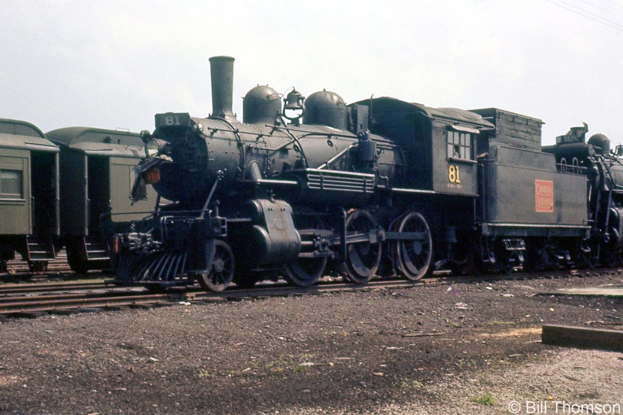 With her career of working branchline assignments in the area at an end, Canadian Nantional 81 sits in the deadline with other steam engines in the yard at Palmerston in 1958, near the end of the steam era. An E10a class 2-6-0 "Mogul" built by CLC in 1910 for the Grand Trunk Railway, 81 would be donated to the City of Palmerston ON in 1959 and put on display, where she can still be found today.