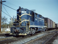C&O GP9 5912 momentarily lets up on the throttle as he slams across the CN diamond. With only an eight car train, this guy was moving!