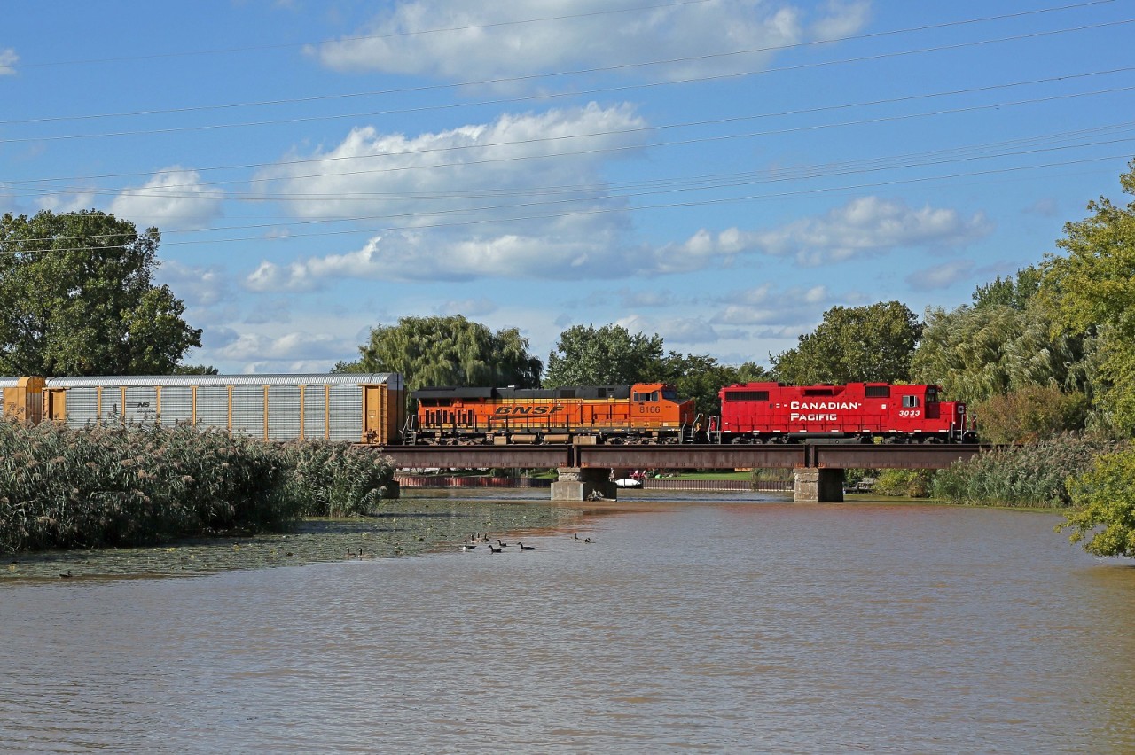 CP 3033-244, with helper BNSF 8166, crosses the Belle River at mile 94.3 on the CP's Windsor Sub.