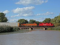 CP 3033-244, with helper BNSF 8166, crosses the Belle River at mile 94.3 on the CP's Windsor Sub.