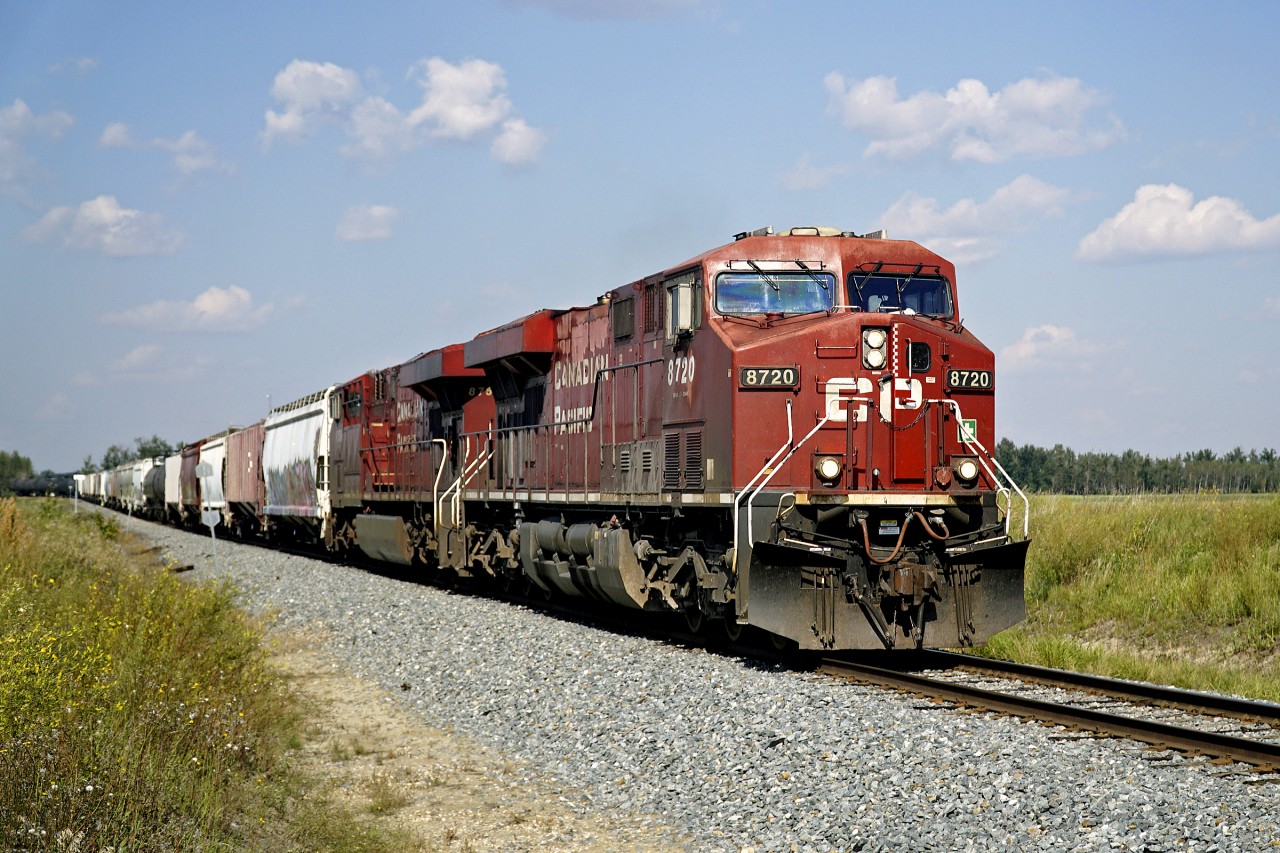 A pair of ES44ACs, Cp 8720 and CP 8759 head south away from Scotford.