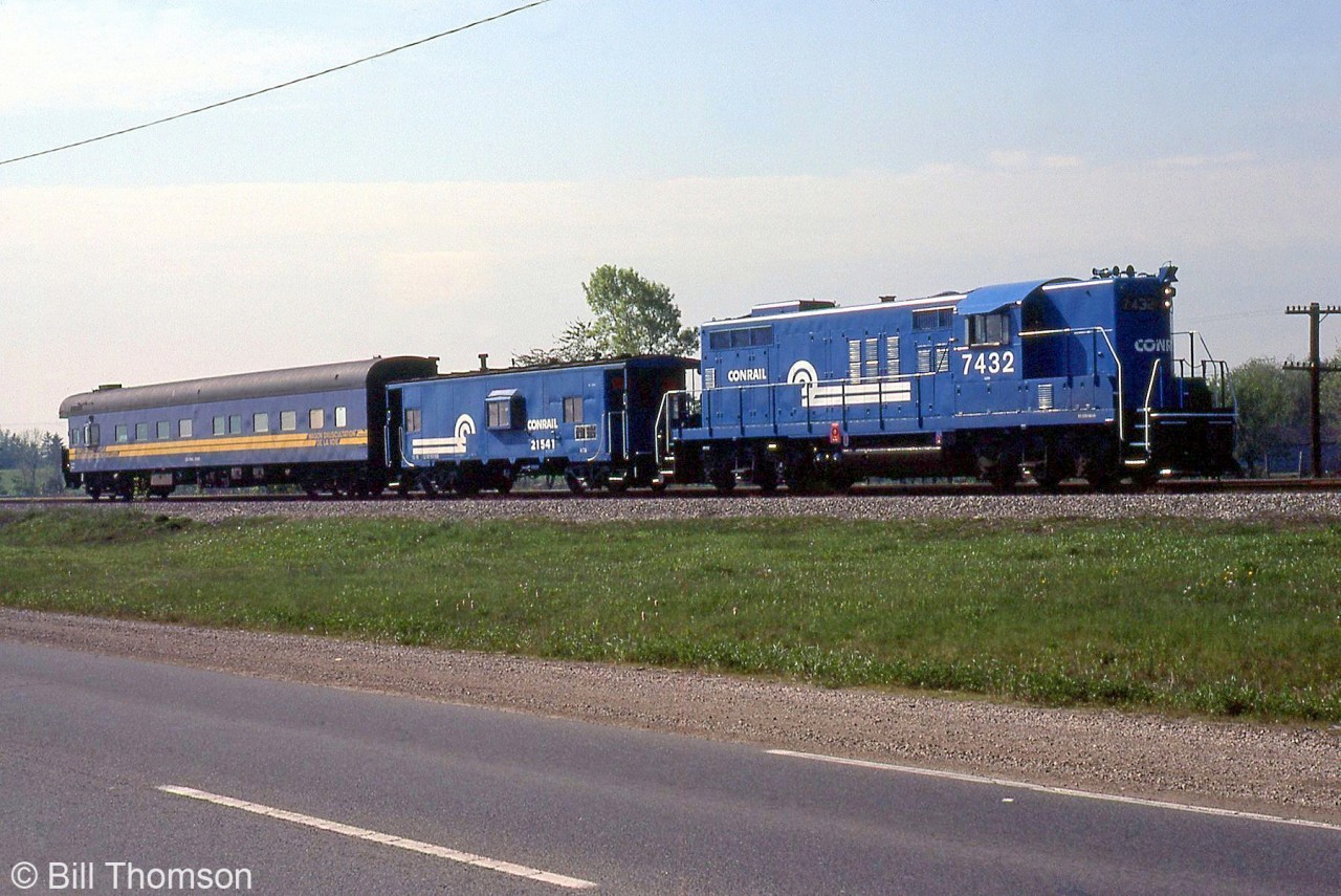 Conrail GP9 7432 and caboose 21541 are coupled with CN Track Geometry Car 15000 (in VIA colours), pictured on the CR CASO Sub a few miles east of Windsor. At the time CN was evaluating the CASO for purchase, which it would do a few years later in a joint acquisition with CP in 1985.