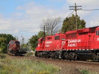 Today both T14 and the OBRY arrived at Streetsville early, and T14 did a rare Friday switch at Ardent Mill. Here we see T14 awaiting the arrival of the headend crew as they prepare to head for the yard after lifting four cars at the elevator. A very short six car eastbound has just dimmed it’s ditch lights as it storms around the curve at the Mississauga Road crossing.