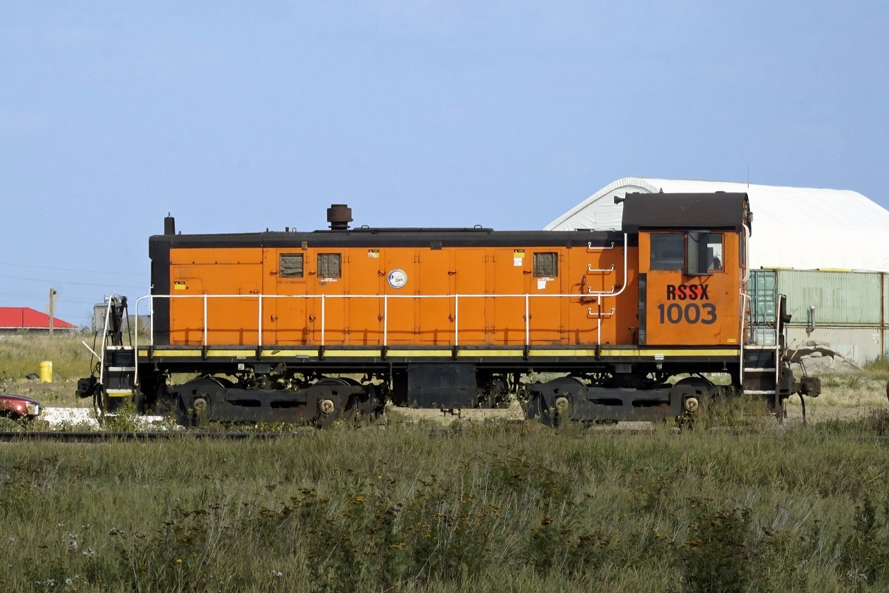 Starting to get a little overgrown with the weeds Alco S-6 switcher ex Dow Chemicals, Fort Saskatchewan is  seen here at the On-Track Railway operations site at Daugh.  Adjacent to the CN Coronado Sub MP 7.4