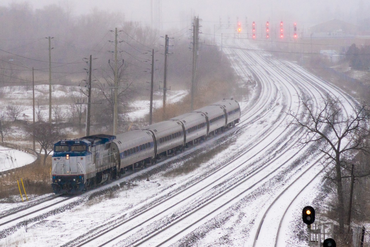 It was a blistery cold and snowy Saturday morning at Oakville GO Station. The parking structure provided little protection, although it kept the falling snow off my camera. Already having made several trips to Montreal on The Adirondack, this would be Amtrak Dash 8 514's only visit to Toronto on the Maple Leaf.