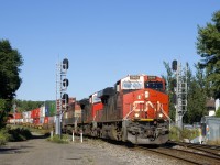 A 636-axle long CN 120 splits a set of signals with CN 2809, CN 2693 & BCOL 4612 up front and CN 3801 mid-train.