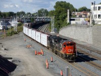 CN 2102 & NS 3623 are the power on CN 324, approaching Turcot Ouest with 43 cars to interchange with the NECR in St. Albans, Vermont.