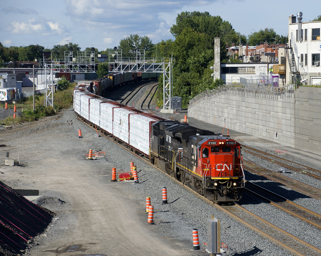 CN 2102 & NS 3623 are the power on CN 324, approaching Turcot Ouest with 43 cars to interchange with the NECR in St. Albans, Vermont.