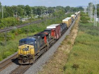 CSXT 54 & CN 2179 lead CN 327 through Pointe-Claire with 55 cars to be set off at Coteau and the rest of the train for interchange to CSXT.