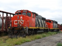 CN 9543 and 9675 were set off in Brantford yard by 385 on Monday.  They have most likely arrived to be the first locomotives assigned to the Hagersville Subdivision when CN takes back operations between Brantford and Garnet on September 18.  CN 9675 was originally built for GO Transit and the green paint it previously wore is showing through the CN paint in a lot of locations.   