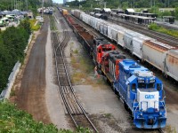 While killing a a couple hours between shifts at the CCMA's, I decided to go check out what was happening at Aldershot.
 
GMTX 2254, and CN 4136 on L551(?) prepare to move a cut of cars + CN 5444.
 
2254 was built in November 1971 as GTW 5810, so in a way it's returned to "home" rails!
