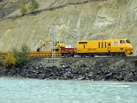 A Herzog MOW train heads east from Golden into the Kicking Horse Canyon.